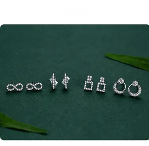 Detailed set of S925 sterling silver studs with infinity and geometric cubic zirconia designs