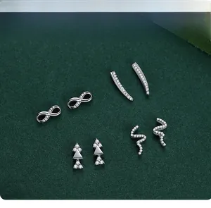 Detailed view of four S925 silver stud earrings set including infinity and geometric shapes