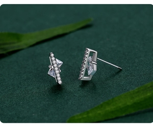 Macro shot of S925 sterling silver geometric earrings with sparkling square stones