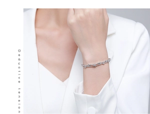 Detail of S925 sterling silver double-layer bracelet with sparkling round zircons