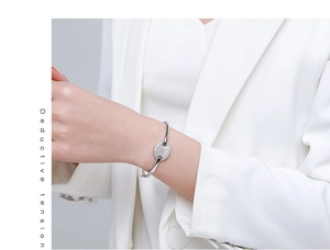 Close-up of s925 silver bracelet with oval plate set with sparkling pavé zircons