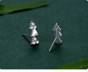 Detailed macro view of S925 sterling silver triangle earrings with sparkling zircons