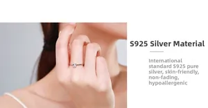 Close-up of S925 sterling silver ring with oval cubic zirconia on woman hand