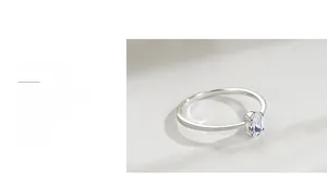 Macro view of oval-cut cubic zirconia in a classic four-prong silver ring setting