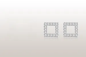 Close-up of geometric square S925 silver stud earrings with pave cubic zirconia crystals