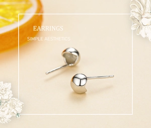 Detailed view of s925 sterling silver bubble stud earrings with crescent cutout