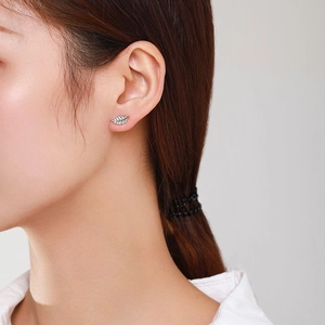 S925 sterling silver leaf stud earrings with sparkling cubic zirconia on female model