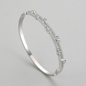 Double-layer S925 silver bracelet featuring asymmetric round zircon stones and a hinged closure
