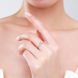 Minimalist 925 sterling silver heart ring with micro-pave crystals on female finger