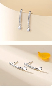 Detailed view of S925 sterling silver star drop earrings with sparkling cubic zirconia stones