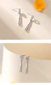 Detail of s925 silver long tassel earrings with sparkling zircon geometric circles