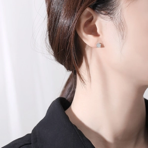 S925 sterling silver flower stud earrings with sparkling cubic zirconia on model