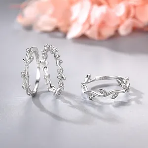 Macro detail of S925 sterling silver olive leaf rings with sparkling cubic zirconia stones