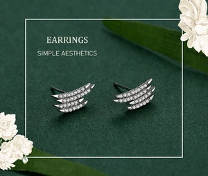 Detail shot of triple-layered S925 silver stud earrings with sparkling cubic zirconia