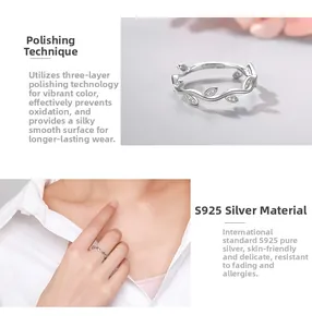 Macro detail of leaf-shaped S925 sterling silver ring with micro-inlaid zircons and polished finish