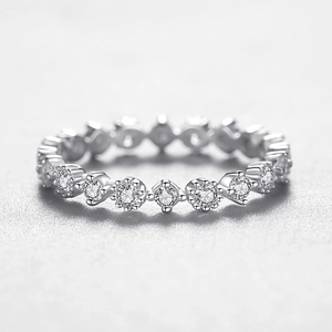 Minimalist 925 sterling silver ring featuring a sparkling zircon pavé band design