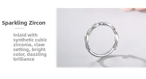 Detail of s925 silver wave ring showing cubic zirconia stones in claw setting