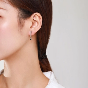Elegant S925 silver star drop earrings with sparkling rhinestones worn by a model