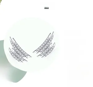 Macro detail of S925 silver geometric stud earrings with polished white zircon inlay