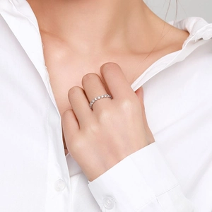 Elegant 925 sterling silver eternity ring with sparkling row of diamonds on model hand