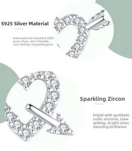 Detail of S925 sterling silver heart arrow stud earrings with micro-inlaid cubic zirconia