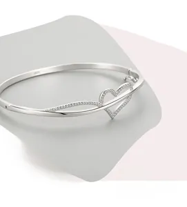 Macro shot of S925 sterling silver stamp on minimalist open heart bracelet
