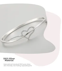 Detail of S925 sterling silver heart bracelet with cubic zirconia inlay and skin-friendly finish
