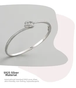 Detailed macro view of S925 sterling silver open bracelet with sparkling zircon stones
