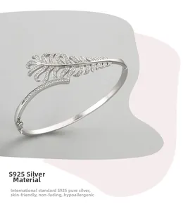 Detailed view of S925 sterling silver feather cuff bangle with sparkling zircon stones