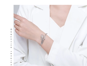 Macro detail of silver leaf bracelet featuring sparkling micro-pave zirconia stones