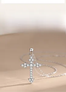 Detailed close-up of 925 sterling silver cross pendant featuring sparkling zircon stones