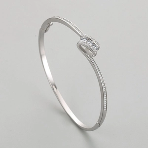 Elegant S925 silver open bangle with intersecting pavé diamonds and round gemstones