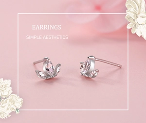 Macro detail of S925 sterling silver crown stud earrings with marquise-cut cubic zirconia