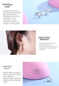 Detailed view of S925 sterling silver heart studs with cubic zirconia and polished finish