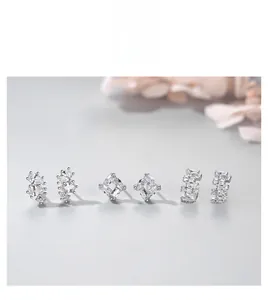 Detailed close-up of s925 silver stud earrings with sparkling cubic zirconia settings