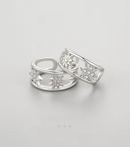 Close-up of 925 sterling silver hollow star ear cuffs with sparkling cubic zirconia