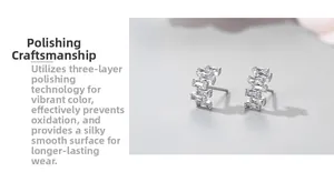 Macro shot of S925 silver stud earrings with step-cut zircons and polished finish
