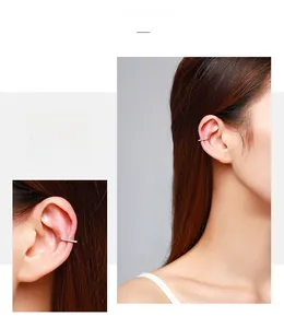 Detail of minimalist S925 silver ear cuff set with pavé cubic zirconia for women