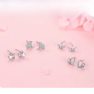 Detail view of S925 sterling silver stud earrings set with heart and star zircon designs