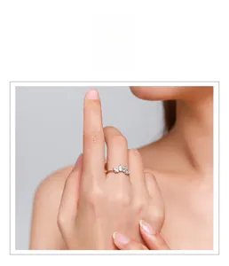 Detailed close-up of s925 sterling silver crown ring with teardrop zirconia on finger