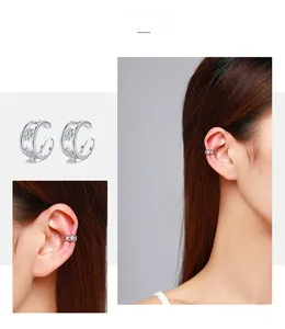 Detail of 925 silver hollow flower ear cuff with zircon accents shown on a model