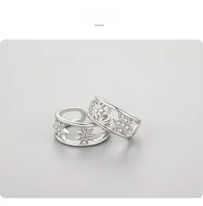Detailed macro view of 925 sterling silver starburst ear cuff with micro-pave cubic zirconia