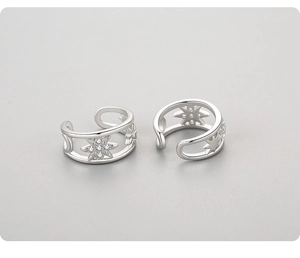Detail view of 925 sterling silver hollow star ear cuffs with zircon inlays