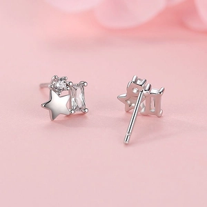 S925 silver star earrings with round and rectangular cubic zirconia on pink background