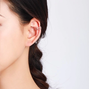 Minimalist 925 silver double layered ear cuff with zircons shown on a female model