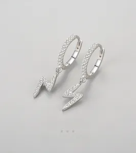 Close-up of S925 sterling silver lightning hoop earrings with white cubic zirconia stones