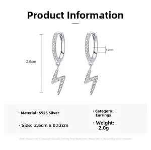 Macro detail of S925 silver lightning bolt drop earrings with white pavé zircons
