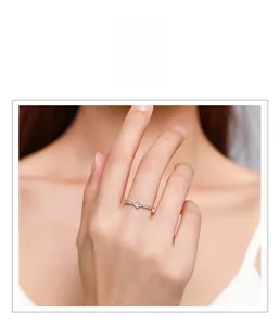 Close-up of a 925 sterling silver ring with a square diamond and small side stones