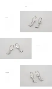 Detailed macro view showing the S925 sterling silver star hoop earrings with zircon