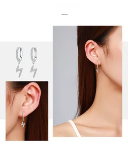 Close-up of 925 sterling silver lightning bolt earrings with pavé set zircon stones